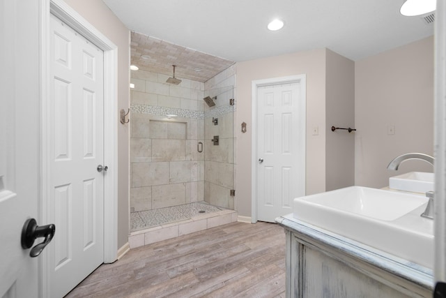 4072 Soderlund Cv, Millington, TN 38053 - full bath featuring a shower stall, wood finished floors, recessed lighting, baseboards, and vanity