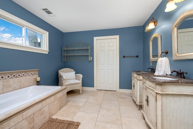 4072 Soderlund Cv, Millington, TN 38053 - bathroom featuring a bath, double vanity, tile patterned flooring, and baseboards