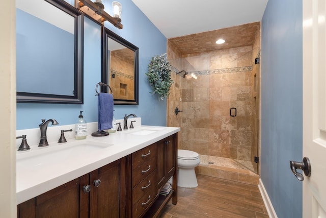 4072 Soderlund Cv, Millington, TN 38053 - full bath with a shower stall, double vanity, toilet, and wood finished floors