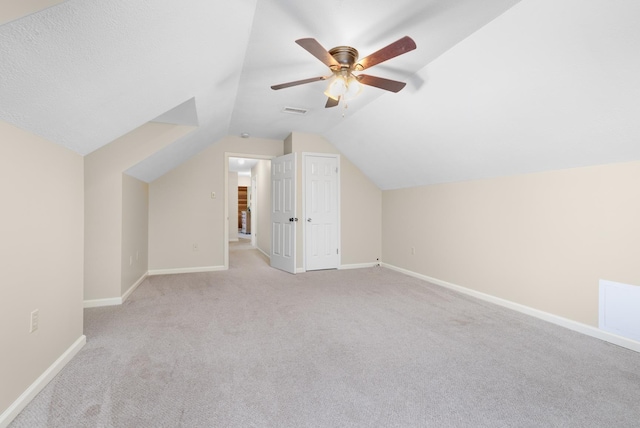 4072 Soderlund Cv, Millington, TN 38053 - additional living space featuring light carpet, lofted ceiling, baseboards, and a ceiling fan