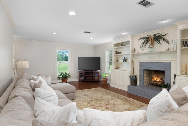 4072 Soderlund Cv, Millington, TN 38053 - living area with wood finished floors, crown molding, recessed lighting, a fireplace, and baseboards