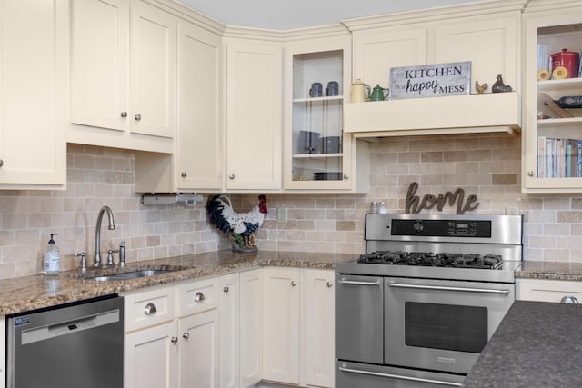 4072 Soderlund Cv, Millington, TN 38053 - kitchen with appliances with stainless steel finishes, a sink, decorative backsplash, and light stone countertops