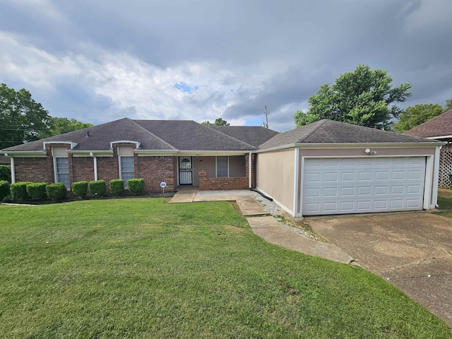 6867 Innsbrook Cv, Memphis, TN 38115 - view of front of home with driveway, a front lawn, an attached garage, a shingled roof, and brick siding
