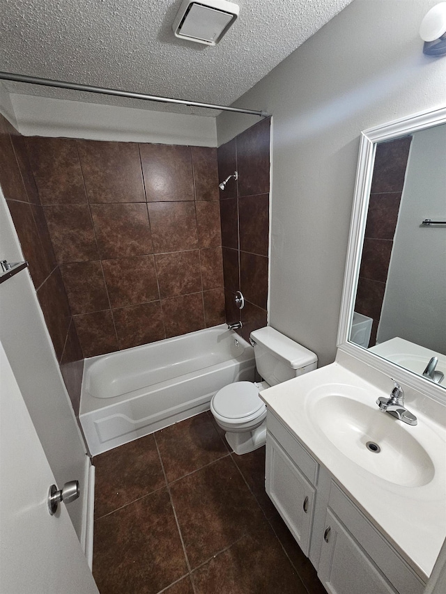 6867 Innsbrook Cv, Memphis, TN 38115 - bathroom featuring toilet, shower / tub combination, vanity, tile patterned flooring, and a textured ceiling
