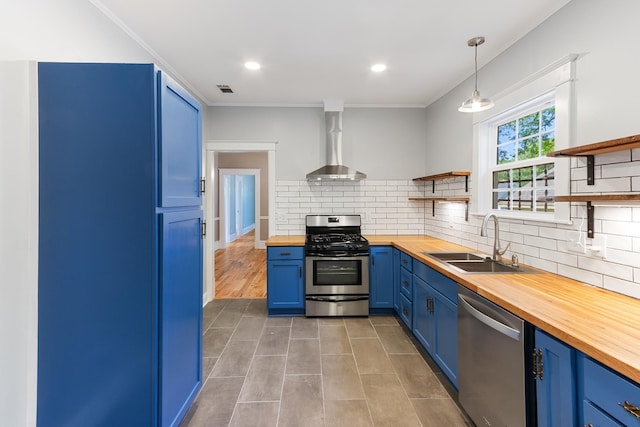 1906 Vollintine Ave, Memphis, TN 38107 - kitchen with wooden counters, open shelves, blue cabinetry, stainless steel appliances, and a sink