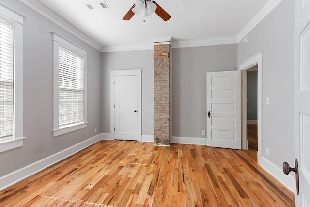 1906 Vollintine Ave, Memphis, TN 38107 - unfurnished bedroom with light wood-style floors, crown molding, baseboards, and ceiling fan