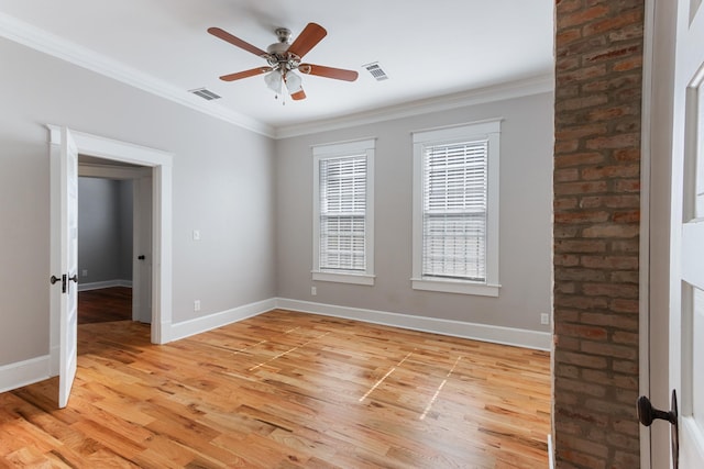 1906 Vollintine Ave, Memphis, TN 38107 - spare room with baseboards, ceiling fan, light wood-type flooring, and ornamental molding