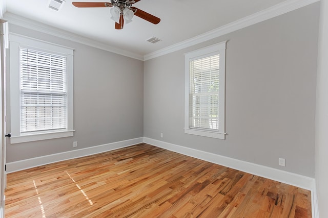 1906 Vollintine Ave, Memphis, TN 38107 - unfurnished room featuring baseboards, crown molding, a ceiling fan, and light wood-type flooring