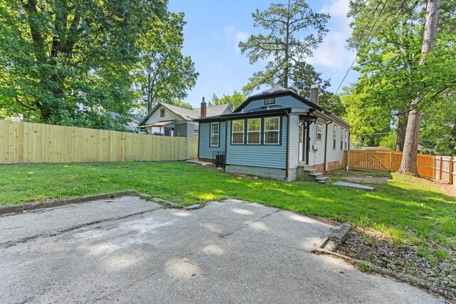 1906 Vollintine Ave, Memphis, TN 38107 - rear view of property featuring entry steps and a patio area