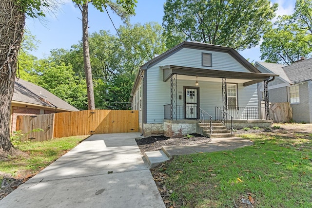 1906 Vollintine Ave, Memphis, TN 38107 - view of front of house with a gate, a porch, and driveway