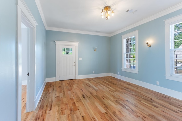 1906 Vollintine Ave, Memphis, TN 38107 - foyer with light wood-type flooring, ornamental molding, and baseboards