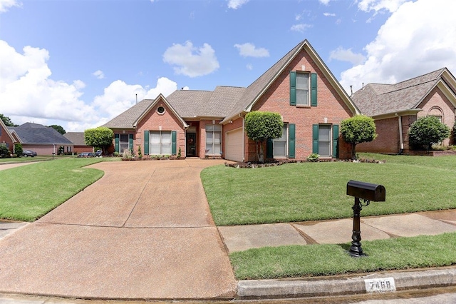 7468 S Links View Ln S, Cordova, TN 38018 - view of front of property featuring brick siding, driveway, a garage, and a front yard
