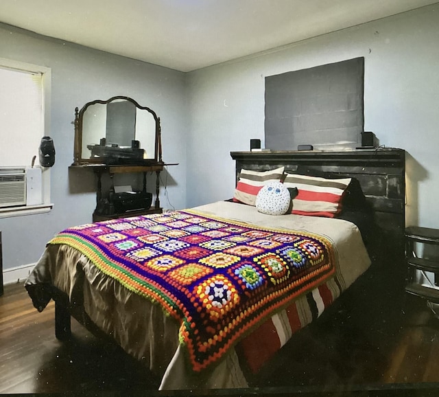 4864 Bowen Ave, Memphis, TN 38122 - bedroom featuring wood finished floors and cooling unit