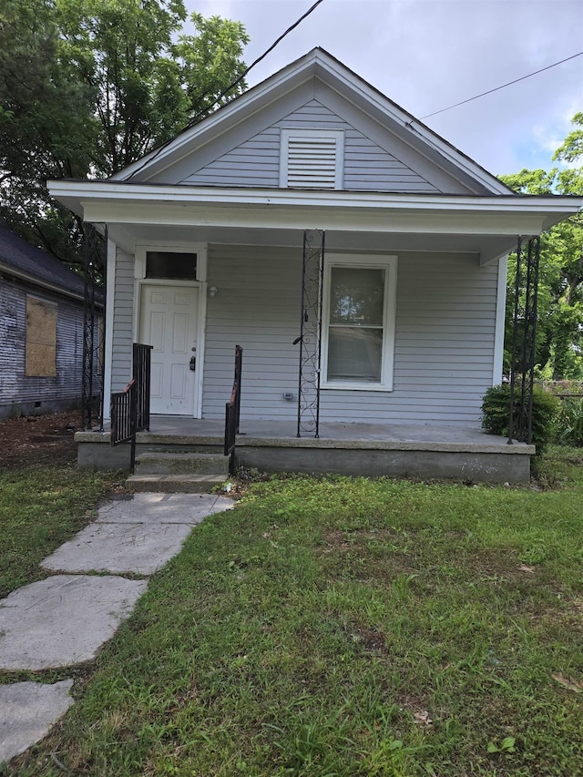961 Joseph Pl, Memphis, TN 38107 - shotgun-style home with a porch and a front yard