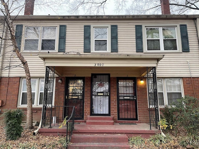 3007 Walnut Grove Rd Unit 1, Memphis, TN 38111 - doorway to property with brick siding and a chimney
