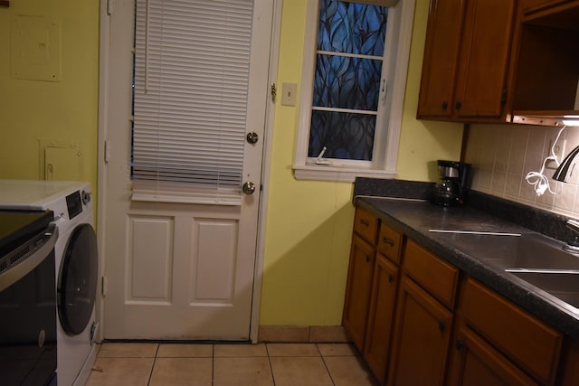 3007 Walnut Grove Rd Unit 1, Memphis, TN 38111 - washroom featuring light tile patterned floors, washing machine and clothes dryer, and baseboards