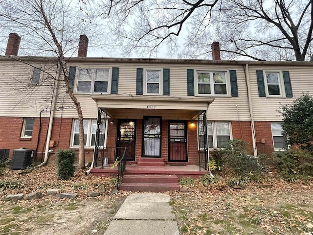 3007 Walnut Grove Rd Unit 1, Memphis, TN 38111 - view of front of property with a chimney, central air condition unit, brick siding, and covered porch