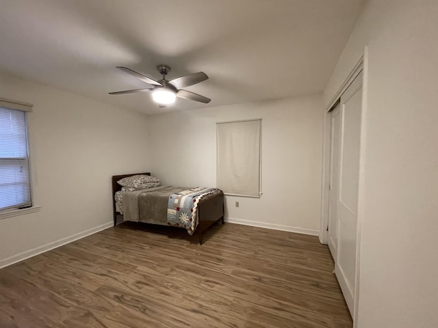 3007 Walnut Grove Rd Unit 1, Memphis, TN 38111 - bedroom with wood finished floors, baseboards, ceiling fan, and a closet