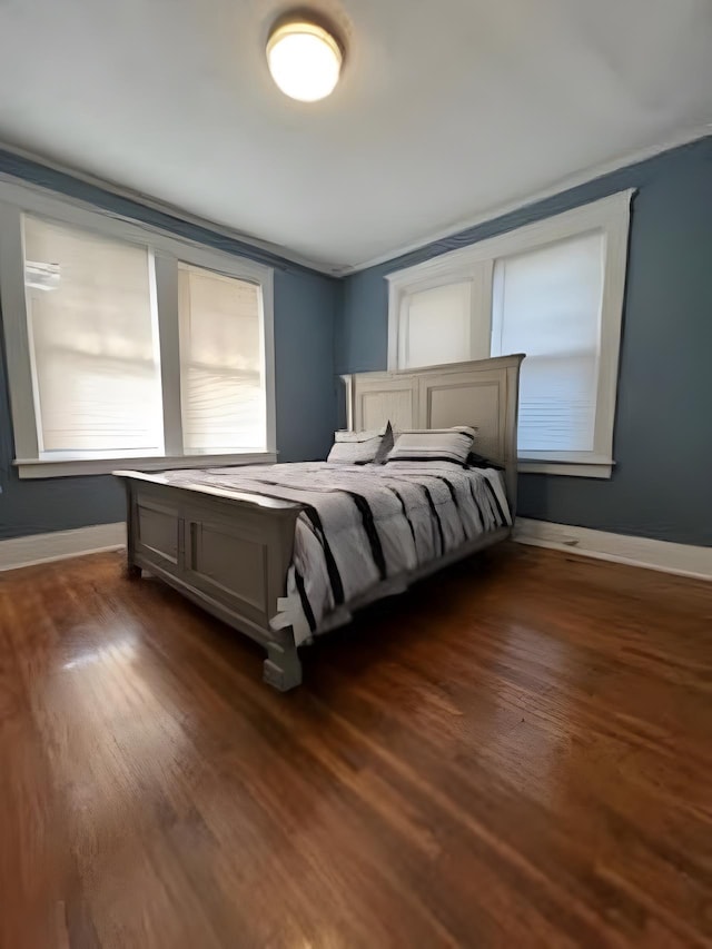 929 N Watkins St, Memphis, TN 38107 - bedroom with dark wood finished floors and baseboards