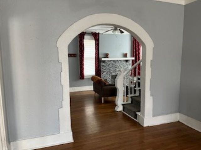929 N Watkins St, Memphis, TN 38107 - hall featuring arched walkways, wood finished floors, baseboards, and stairs