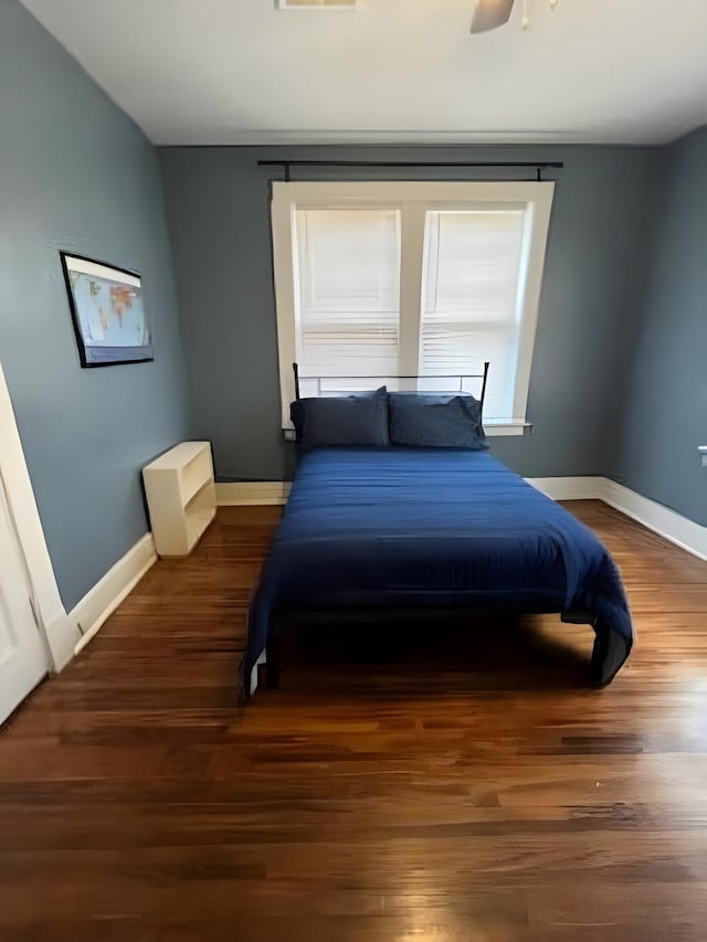 929 N Watkins St, Memphis, TN 38107 - bedroom featuring baseboards, wood finished floors, and ceiling fan