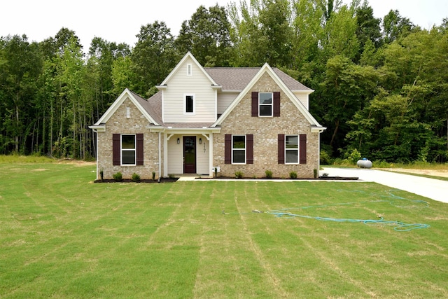 117 Centerline Roper Loop, Byhalia, MS 38611 - traditional-style home with a front lawn, brick siding, and roof with shingles