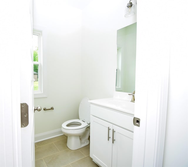 117 Centerline Roper Loop, Byhalia, MS 38611 - half bathroom featuring vanity, toilet, tile patterned flooring, and baseboards