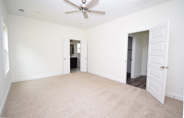 117 Centerline Roper Loop, Byhalia, MS 38611 - unfurnished bedroom featuring carpet flooring, baseboards, ensuite bathroom, and a ceiling fan
