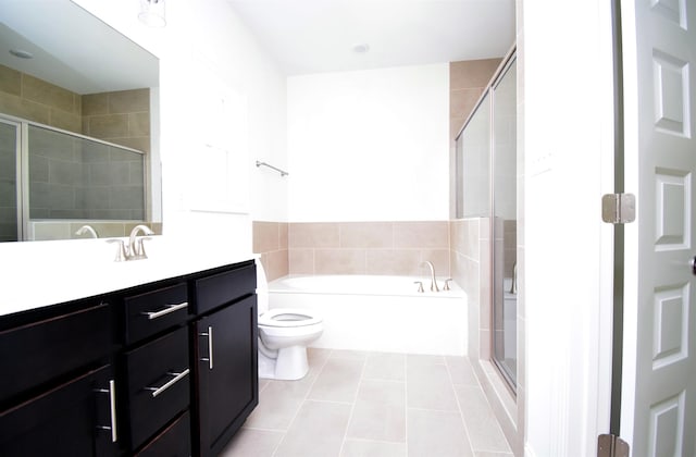 117 Centerline Roper Loop, Byhalia, MS 38611 - bathroom featuring vanity, tile patterned floors, a garden tub, a shower stall, and toilet