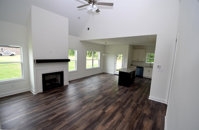 117 Centerline Roper Loop, Byhalia, MS 38611 - unfurnished living room featuring high vaulted ceiling, a fireplace, dark wood-style floors, a ceiling fan, and baseboards