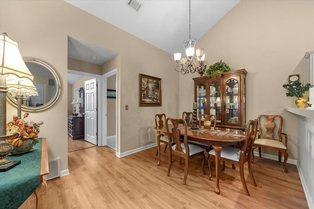 1961 Appling Oaks Cir Unit 29, Cordova, TN 38016 - dining room with a chandelier, light wood-style flooring, baseboards, and high vaulted ceiling