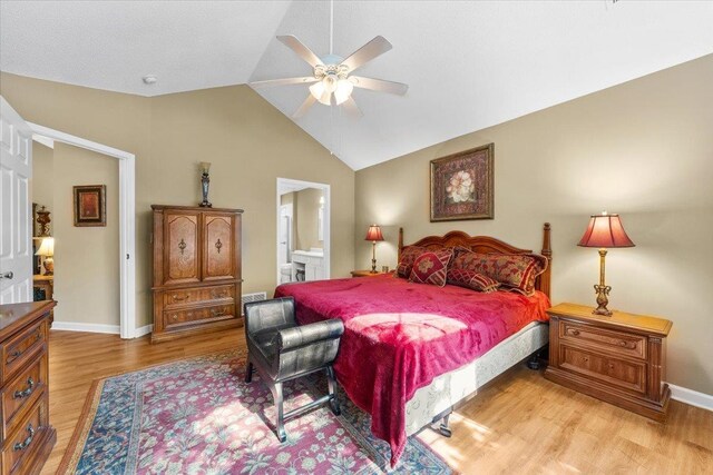 1961 Appling Oaks Cir Unit 29, Cordova, TN 38016 - bedroom featuring light wood-style flooring, lofted ceiling, baseboards, connected bathroom, and ceiling fan