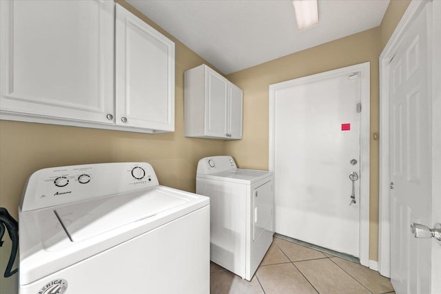 1961 Appling Oaks Cir Unit 29, Cordova, TN 38016 - laundry area with washer and clothes dryer, light tile patterned floors, and cabinet space
