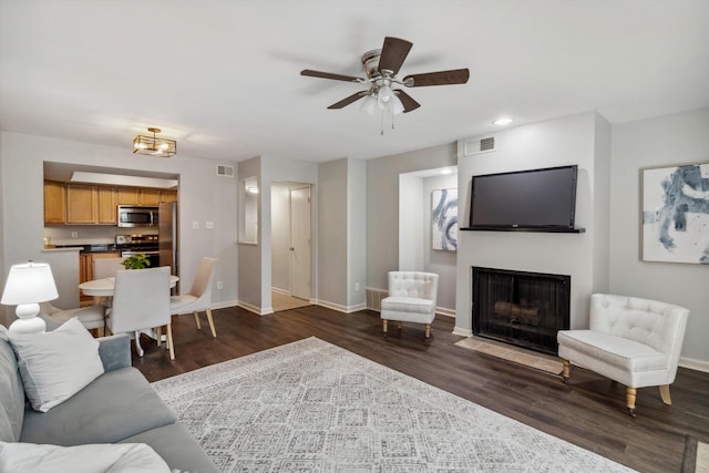 1819 Crossflower Cv Unit 85, Germantown, TN 38138 - living room with baseboards, dark wood-type flooring, a fireplace with flush hearth, ceiling fan, and recessed lighting
