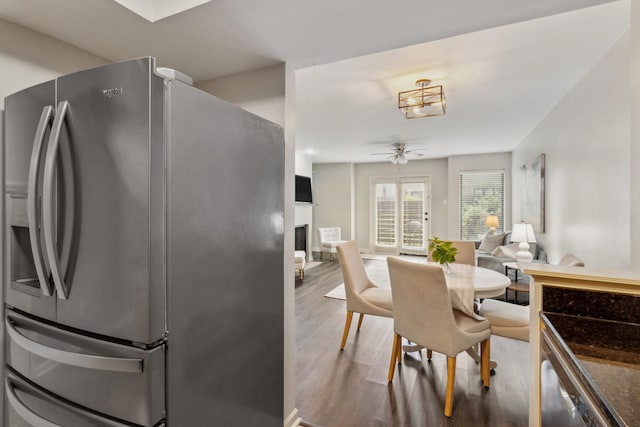1819 Crossflower Cv Unit 85, Germantown, TN 38138 - kitchen featuring stainless steel fridge, wood finished floors, a fireplace, and ceiling fan