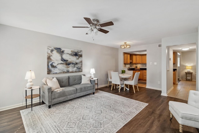 1819 Crossflower Cv Unit 85, Germantown, TN 38138 - living area featuring dark wood finished floors, a ceiling fan, and baseboards