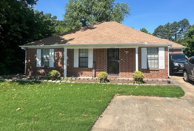 3769 Raleigh-Millington Rd, Memphis, TN 38128 - bungalow-style house with brick siding, a front yard, and roof with shingles