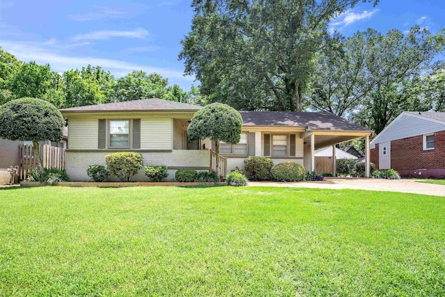 4951 Lynbar Ave, Memphis, TN 38117 - view of front of house with driveway, brick siding, and a carport