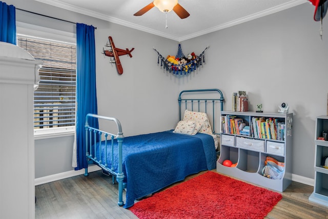 4951 Lynbar Ave, Memphis, TN 38117 - bedroom featuring wood finished floors, multiple windows, crown molding, baseboards, and ceiling fan