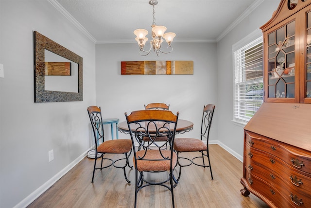 4951 Lynbar Ave, Memphis, TN 38117 - dining room featuring light wood-style floors, baseboards, a chandelier, and ornamental molding