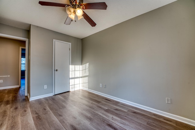 5432 Burton Church Cv Unit 5432, Bartlett, TN 38134 - empty room featuring ceiling fan, wood finished floors, and baseboards