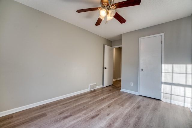 5432 Burton Church Cv Unit 5432, Bartlett, TN 38134 - unfurnished bedroom featuring wood finished floors, baseboards, and a ceiling fan