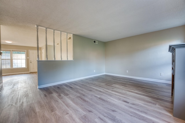 5432 Burton Church Cv Unit 5432, Bartlett, TN 38134 - empty room with a textured ceiling, baseboards, and wood finished floors