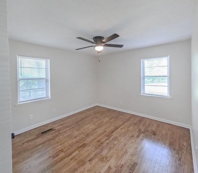 3547 Randolph St, Memphis, TN 38127 - spare room with wood finished floors, a ceiling fan, and baseboards