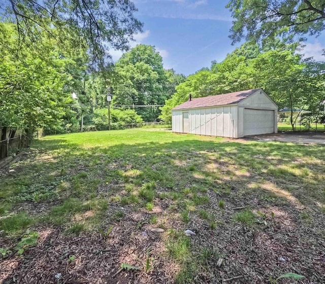 3547 Randolph St, Memphis, TN 38127 - view of grassy yard with a garage and an outbuilding