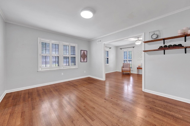 5238 Peg Ln, Memphis, TN 38117 - unfurnished living room with wood finished floors and ornamental molding