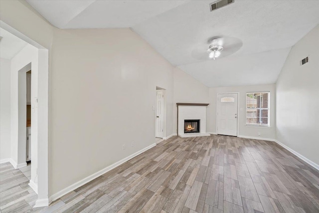8394 Palm Springs Dr, Memphis, TN 38016 - unfurnished living room featuring vaulted ceiling, ceiling fan, wood finished floors, a fireplace, and baseboards