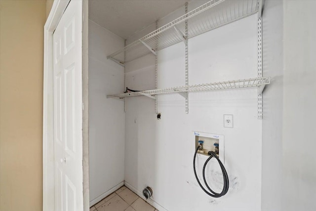 8394 Palm Springs Dr, Memphis, TN 38016 - washroom with hookup for a washing machine, hookup for an electric dryer, and light tile patterned floors