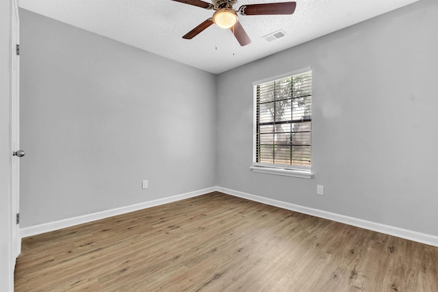 5315 Sleepy Oak Cv, Memphis, TN 38141 - empty room featuring wood finished floors, a ceiling fan, and baseboards