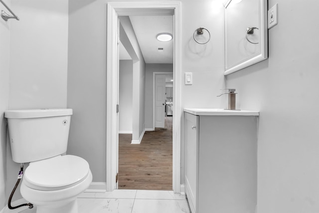 5315 Sleepy Oak Cv, Memphis, TN 38141 - bathroom with toilet, vanity, baseboards, and marble finish floors